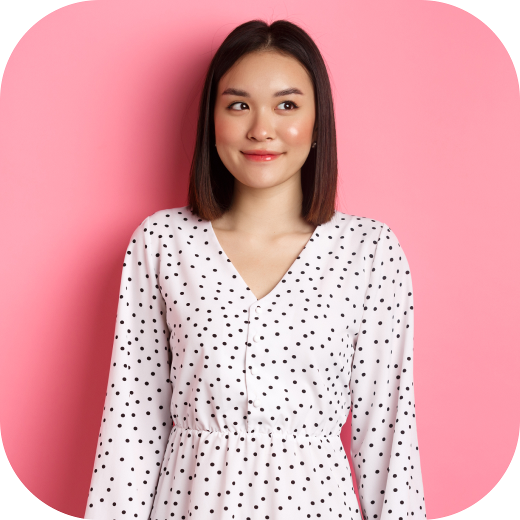 cute-asian-woman-smiling-looking-left-copy-space-standing-romantic-pink-background 1